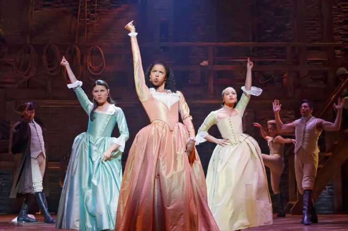 Phillipa Soo, Rene Elise Goldsberry and Jasmine Cephas Jones singing the Schuyler Sisters in the musical Hamilton