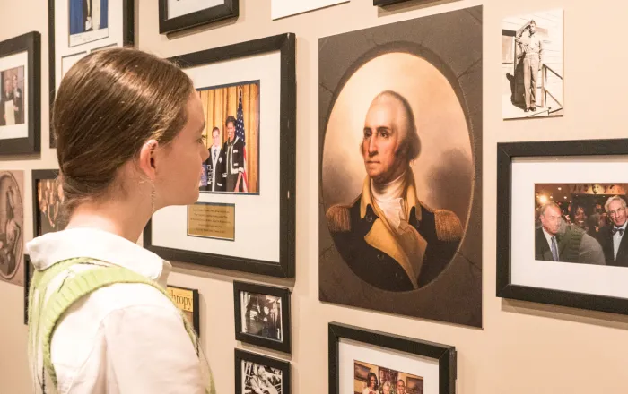 EduHam Winner examining a portrait of George Washington at the Gilder Lehrman office